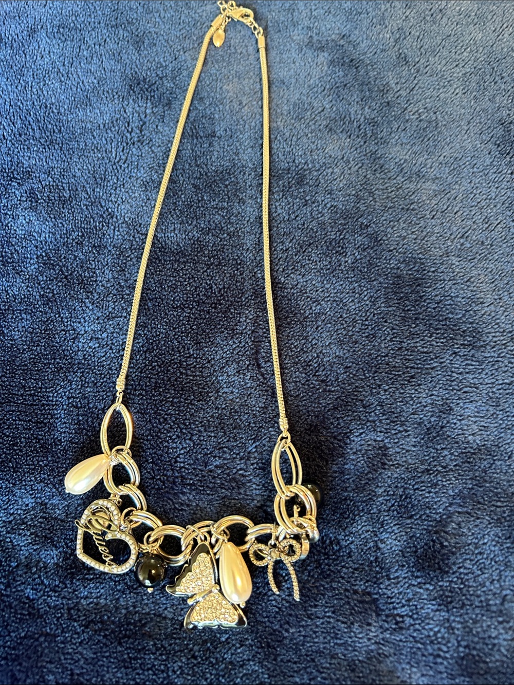 Guess Silver-Tone Multi-Charm Necklace with Black and Cream Accents